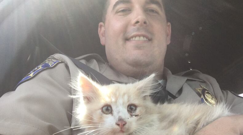 Officer Smith with Bridges the kitten.