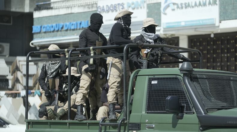 FILE -Police patrol the streets on election day in Zanzibar, Tanzania, Oct. 30, 2025. (AP Photo, File)