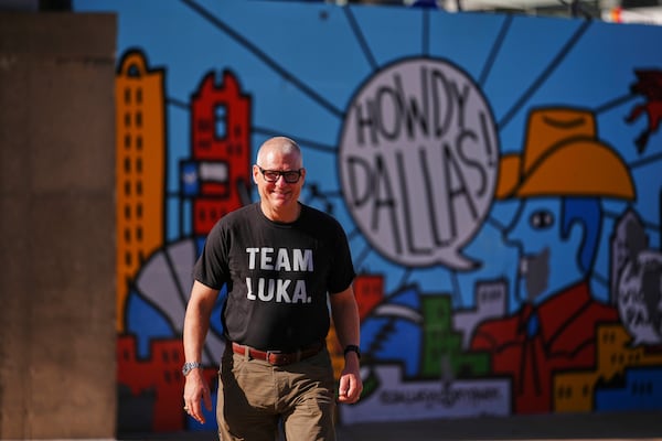 David Welch of Dallas, wears a "Team Luka" shirt as he arrives at the arena for an NBA basketball game between the Los Angeles Lakers and the Dallas Mavericks in Dallas, Wednesday, April 9, 2025. (AP Photo/Julio Cortez)
