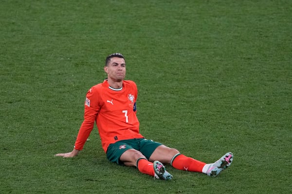 Portugal's Cristiano Ronaldo lies on the ground during the Nations League final soccer match between Portugal and Spain at the Allianz Arena in Munich, Germany, Sunday, June 8, 2025. (AP Photo/Michael Probst)