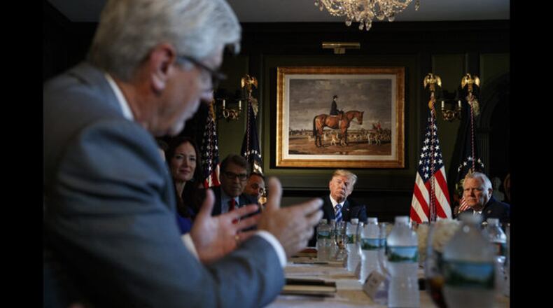 President Donald Trump and Gov. Nathan Deal at a meeting about prison reform, Thursday, Aug. 9, 2018, at Trump National Golf Club in Bedminster, N.J. (AP Photo/Carolyn Kaster)