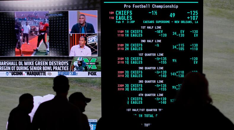 FILE - Betting odds for Super Bowl LIX are displayed on monitors at the Circa resort and casino sports book, Jan. 30, 2025, in Las Vegas. (AP Photo/John Locher, File)