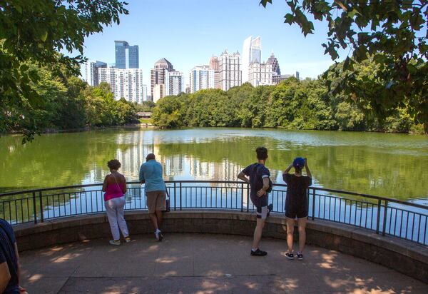 People photograph the Atlanta skyline during the Atlanta Jazz Festival in Piedmont Park on Sunday, September 5, 2021. STEVE SCHAEFER FOR THE ATLANTA JOURNAL-CONSTITUTION