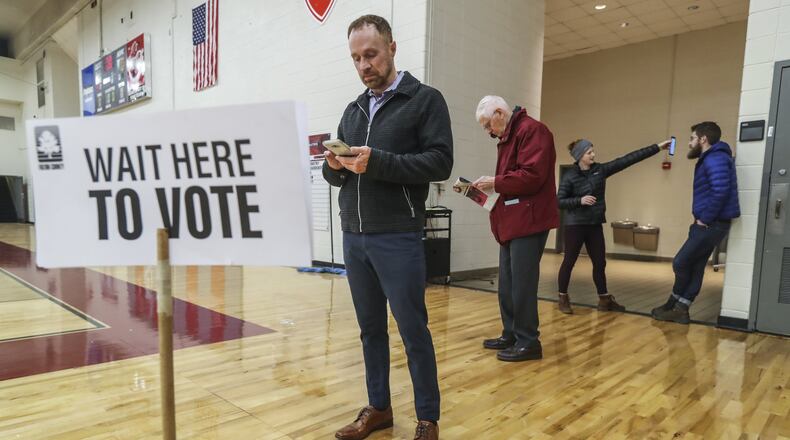 Grant Jones was first in line at Henry W. Grady High School to vote in a special election in December 2018. JOHN SPINK/JSPINK@AJC.COM