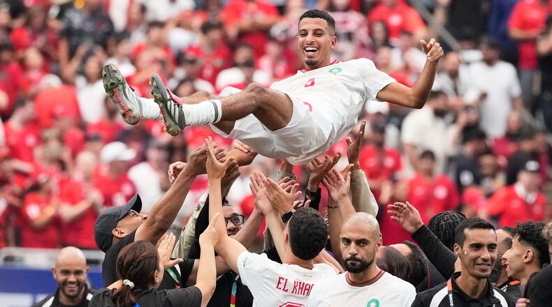 Morocco's Azzedine Ounahi is thrown in the air by his teammates after the World Cup round of 16 soccer match against Canada in Houston, Saturday, July 4, 2026. (AP Photo/David J. Phillip)