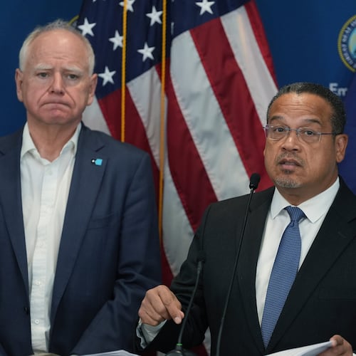 Attorney General Keith Ellison, right, and Minnesota Gov. Tim Walz give a news conference in Blaine, Minn., Sunday, Jan. 25, 2026. (AP Photo/Abbie Parr)