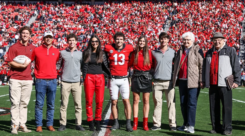 Georgia quarterback Stetson Bennett (13) poses with his family during the Senior Day ceremony before the Bulldogs’ game against Charleston Southern on Dooley Field at Sanford Stadium in Athens on Saturday, Nov. 20, 2021. His younger brother Luke, third from right, will walkon with the Bulldogs this season. (Photo by Tony Walsh/UGAAA)