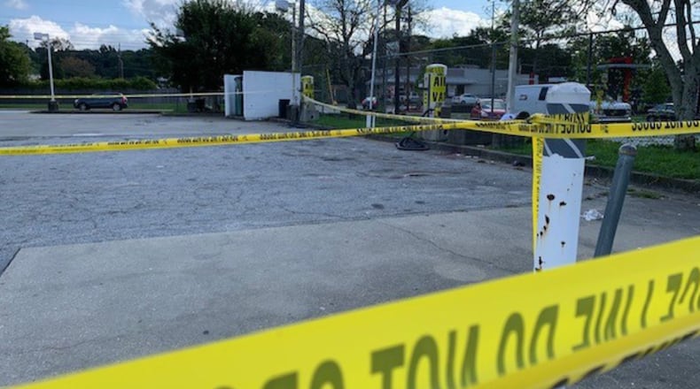 Police are searching for a man accused of stabbing three people at random Monday morning in southwest Atlanta.
