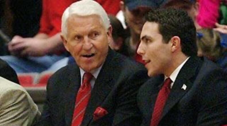 Georgia Tech coach Josh Pastner (right) confers on the bench with coaching legend Lute Olson (left) during Pastner's time as an Arizona assistant coach.