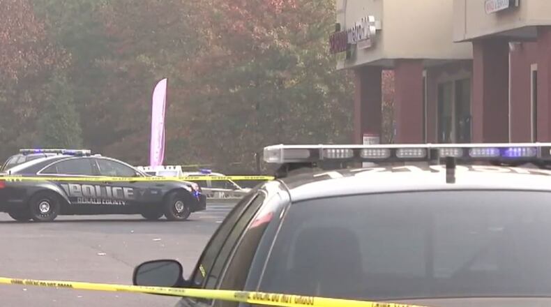 Police say two innocent bystanders were shot during a shootout near a gas station on DeKalb County's Snapfinger Woods Drive. (Credit: Channel 2 Action News)