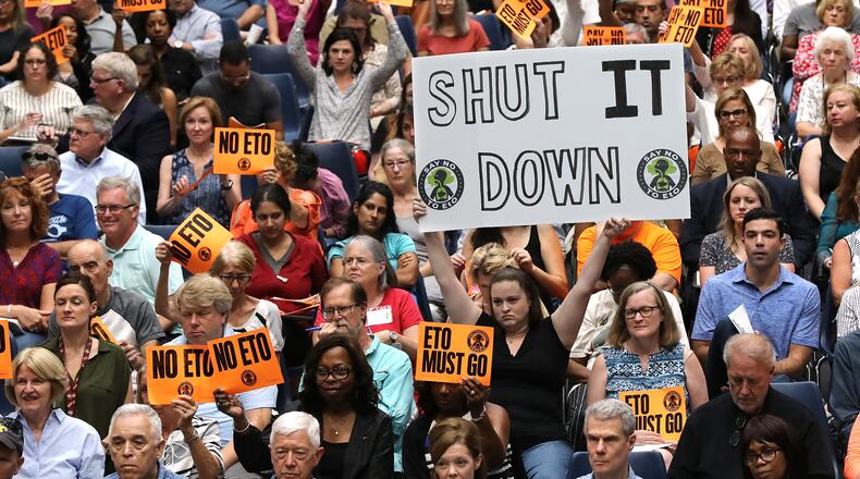 August 19, 2019 Marietta: Many area residents hold signs in opposition as Cobb officials and environmental regulators hold a town hall and community forum in the wake of reports that Cobb and Fulton have high levels of carcinogenic gas on Monday, August 19, 2019, in Marietta. A user and emitter of the gas, Sterigenics, which sterilizes medical equipment, operates in the area.  Curtis Compton/ccompton@ajc.com