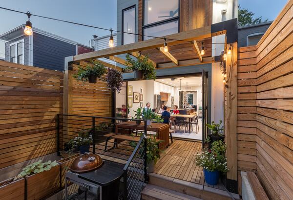 While the facade of Will Teass' home is traditional to be mindful of the neighborhood's aesthetics, the rear-facing portion has a more modern look. Photo: Courtesy of Kate Wichlinski/NetZero