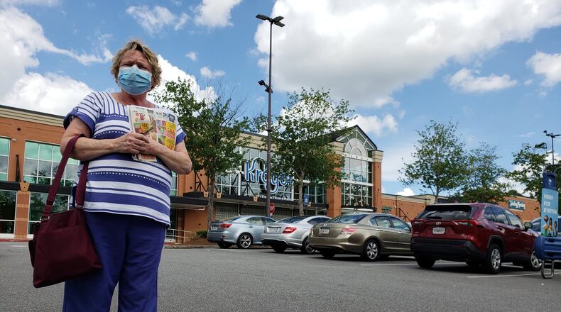 Becky Phillips wears a mask when she goes out to a north Fulton Kroger, convinced it will help protect others from the coronavirus. MATT KEMPNER / AJC