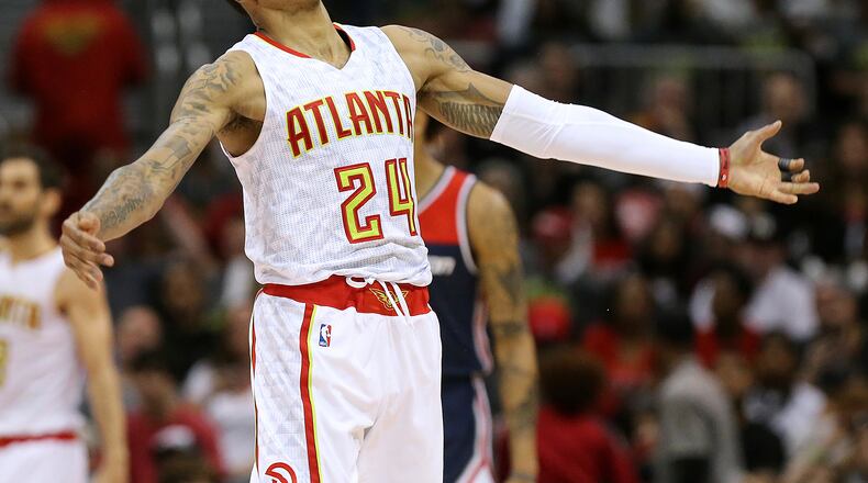 Atlanta Hawks' Kent Bazemore reacts to scoring against the Washington Wizards during Game 3 of an NBA basketball first-round playoff series Saturday, April 22, 2017, in Atlanta. (Curtis Compton/Atlanta Journal-Constitution via AP)