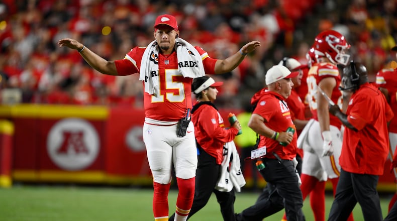 Kansas City Chiefs quarterback Patrick Mahomes (15) motions to teammates during the second half of a preseason NFL football game against the Seattle Seahawks, Friday, Aug. 28, 2026, in Kansas City, Mo. (AP Photo/Reed Hoffmann)
