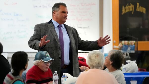 Everett, Mass. Mayor Carlo DeMaria talks with guests while visiting a senior luncheon following a bingo game at the Connolly Center, Monday, Jan. 13, 2025, in Everett. (AP Photo/Charles Krupa)