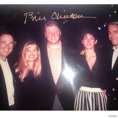 This undated photo released by Democrats on the House Oversight Committee shows former President Bill Clinton, Ghislaine Maxwell and Jeffrey Epstein, with Clinton's signature at the top of the photo. (House Oversight Committee via AP)