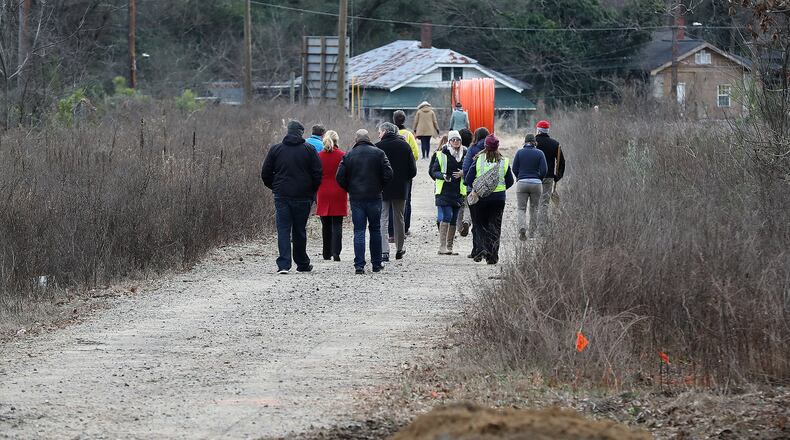 Local residents walk on an undeveloped portion of the Beltline in the Pittsburgh community, a segment where construction work will soon begin. The newest portion of the trail will connect the Eastside and Westside trail corridors. Curtis Compton ccompton@ajc.com