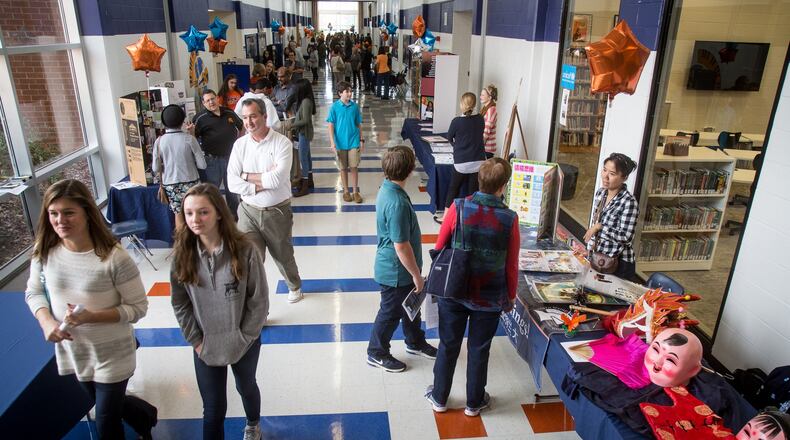 Parents and potential new students walk the halls of North Springs Charter High School during the school’s open house Sunday in Sandy Springs, GA November 6, 2016. STEVE SCHAEFER / SPECIAL TO THE AJC