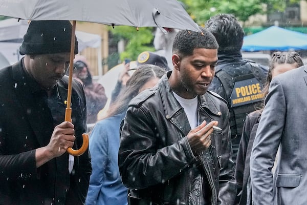 Rapper Kid Cudi, right, arrives at Federal Court for the trial of Sean "Diddy" Combs, in New York, Thursday, May 22, 2025. (AP Photo/Richard Drew)
