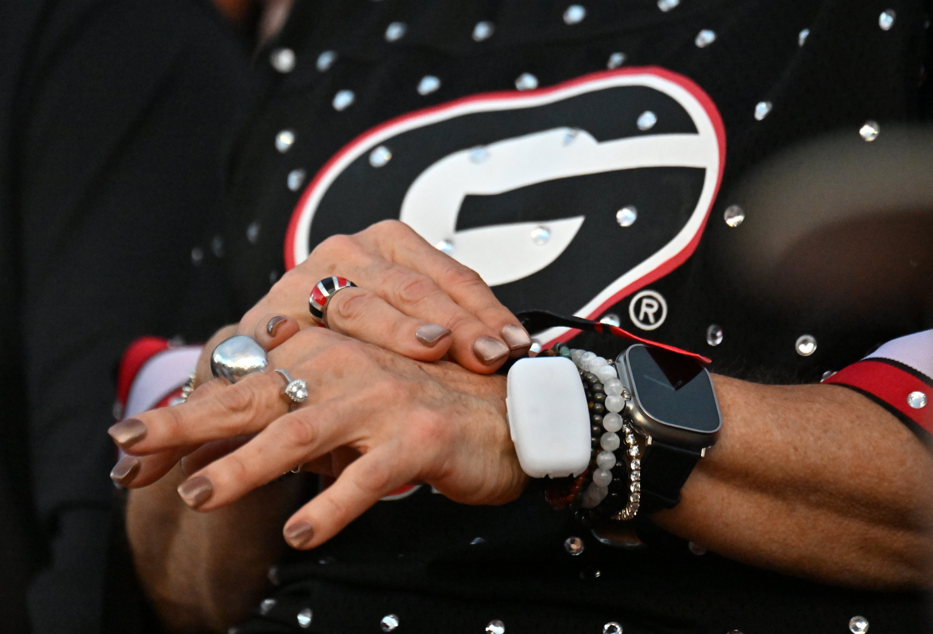 Georgia fan wears a LED bracelet before Georgia game against Alabama in an NCAA football game at Sanford Stadium, Saturday, September 27, 2025, in Athens. (Hyosub Shin / AJC)
