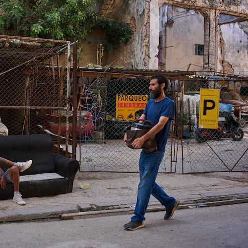 A man rests on a sofa on a street in Havana, Cuba, Thursday, Aug. 27, 2026. (AP Photo/Ramon Espinosa)