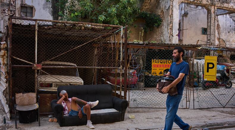 A man rests on a sofa on a street in Havana, Cuba, Thursday, Aug. 27, 2026. (AP Photo/Ramon Espinosa)