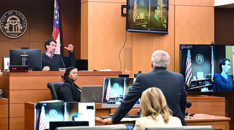 Fulton Superior Court Judge Robert McBurney (background) speaks to legislators’ attorney, Don Samuel during a motion hearing at Fulton County Courthouse in Atlanta on Friday, July 1, 2022. Fulton Superior Court Judge Robert McBurney at a roughly 90-minute hearing Friday did not come to a final decision about what exactly the District Attorney’s office can ask Lt. Gov. Geoff Duncan, former state Sen. William Ligon of Brunswick and several other unnamed state legislators. But he said that anything related to their conversations with other legislators or motivations are off-limits. (Hyosub Shin / Hyosub.Shin@ajc.com)