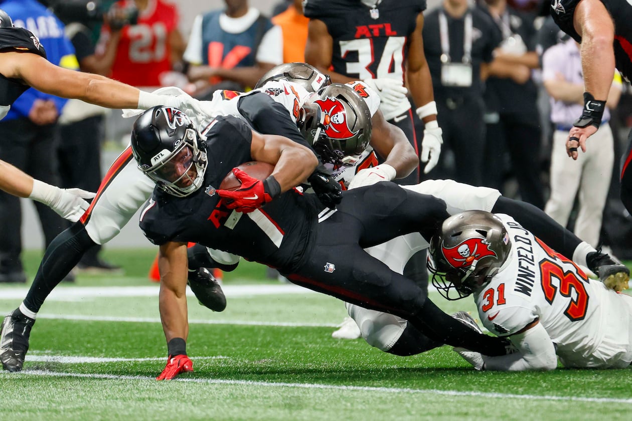 Atlanta Falcons running back Bijan Robinson is tackled during the second half of September's game against the Tampa Bay Buccaneers. (Miguel Martinez/AJC)
