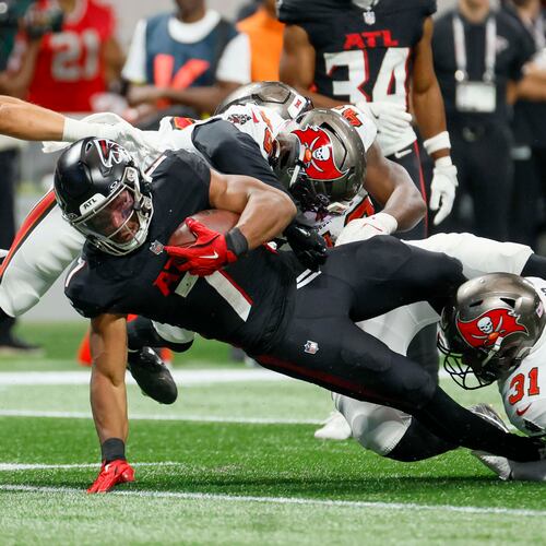 Atlanta Falcons running back Bijan Robinson is tackled during the second half of September's game against the Tampa Bay Buccaneers. (Miguel Martinez/AJC)