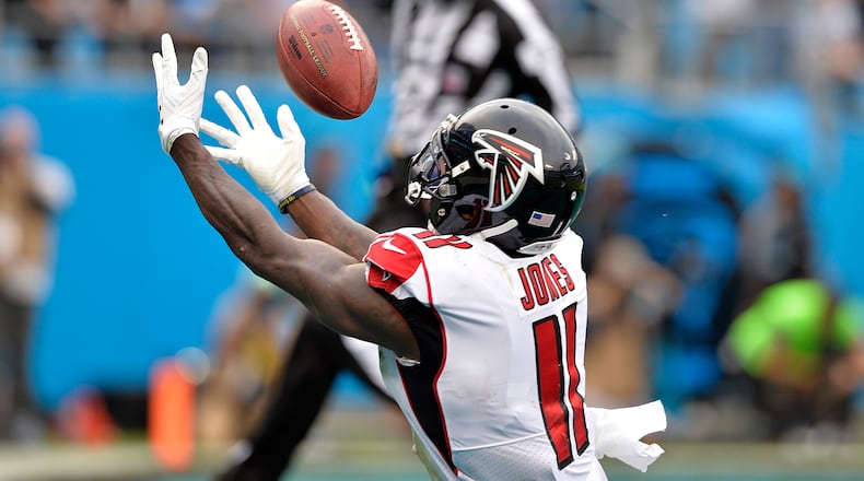 Falcons wide receiver Julio Jones tries  for the ball against the Panthers in the fourth quarter Sunday at Bank of America Stadium in Charlotte, N.C.