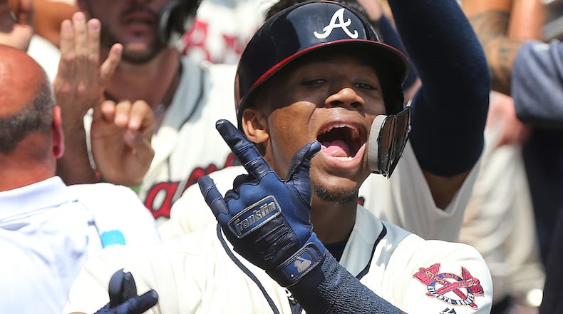 Braves Ronald Acuna Jr. reacts in the dugout after hitting a two-run homer to take a 4-2 lead over the Milwaukee Brewers during the second inning in a MLB baseball game on Sunday, August 12, 2018, in Atlanta. Curtis Compton/ccompton@ajc.com