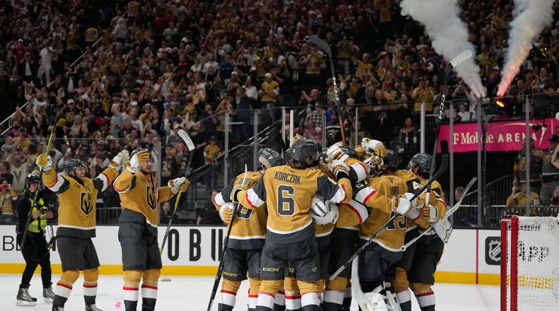 Vegas Golden Knights players celebrate after winning Game 4 of the Western Conference finals NHL hockey Stanley Cup playoff series against the Colorado Avalanche Tuesday, May 26, 2026, in Las Vegas. (AP Photo/John Locher)