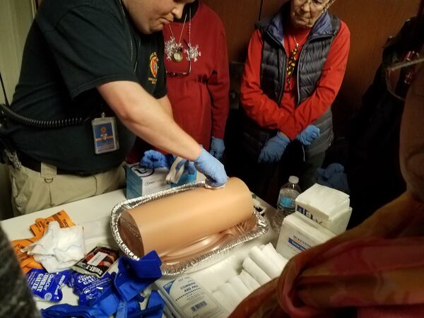 March 24, 2018: An instructor provides training as part of the “Stop the Bleed” program at the DeKalb Fire and Rescue administration building. Photo: Jennifer Peebles/AJC
