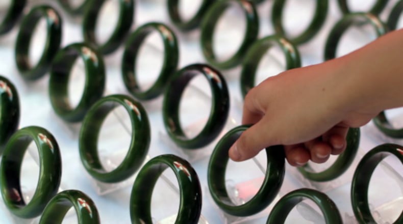A customer looks at jade bracelets at a market in China. Jade is a big business in China. A Chinese woman, who dropped a jade bracelet valued at $44,000 and broke it, promptly fainted and had to be revived by her family. She hasn’t reached an agreement, yet, on a repayment amount for the broken bangle.