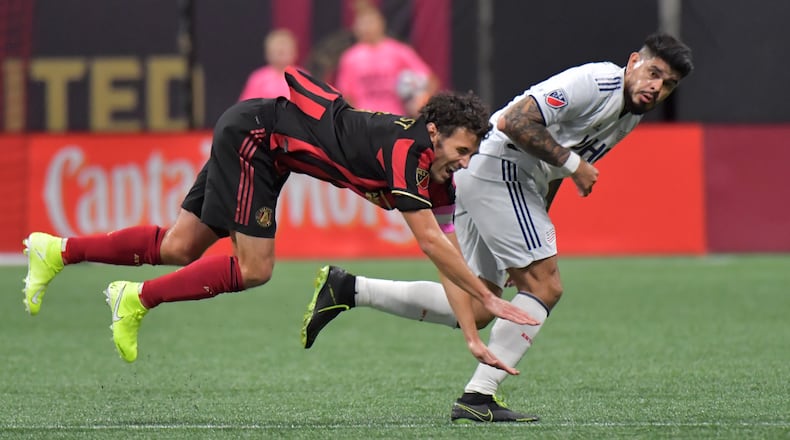 October 19, 2019 Atlanta - Atlanta United defender Michael Parkhurst (3) battles with New England Revolution forward Gustavo Bou (7) for the ball in the second half during the first round of the MLS playoffs at Mercedes-Benz Stadium on Saturday, October 19, 2019. Atlanta United won 1-0 over the New England Revolution. (Hyosub Shin / Hyosub.Shin@ajc.com)