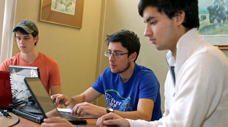 Southern Polytechnic State University freshman Doug Baldwin, of Cumming, left, Sam Shackleford, also of Cumming, center, and Liel Vanderhoeven, of Roswell, study for their finals on campus Thursday morning in Marietta, Ga., December 5, 2013. Photo by Jason Getz / AJC