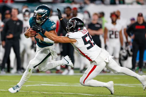 Philadelphia Eagles quarterback Jalen Hurts runs with the football against Atlanta Falcons defensive tackle Brandon Dorlus in the second quarter at Lincoln Financial Field on Monday, Sept. 16, 2024, in Philadelphia. (Yong Kim/The Philadelphia Inquirer/TNS)