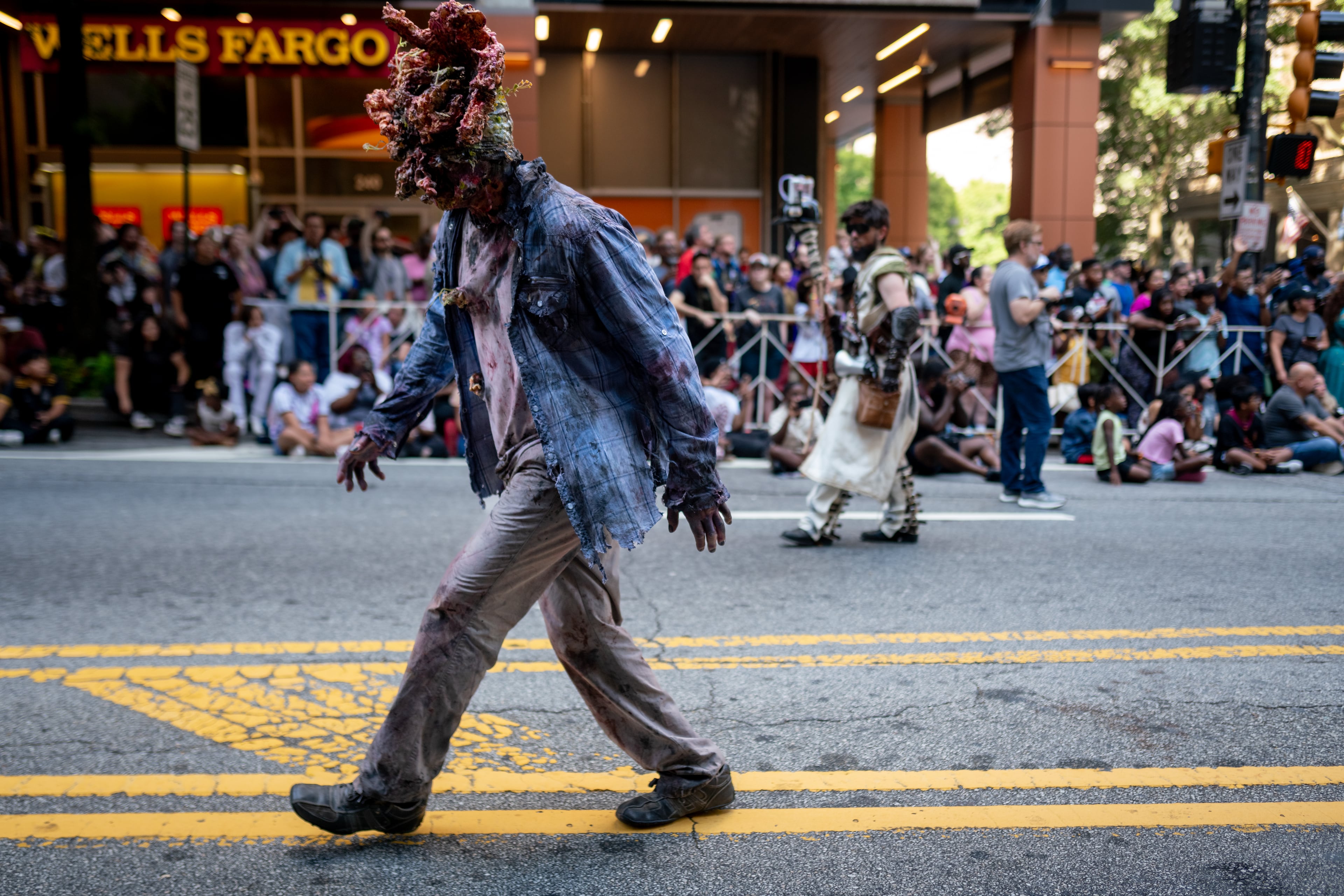 Thousands lined up along Peachtree Street on Saturday morning, August 31, 2024, for the annual Dragon Con parade in Atlanta. (Ben Hendren for The Atlanta Journal-Constitution)