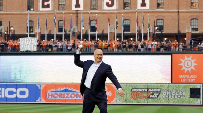 Former Baltimore Oriole Cal Ripken, Jr., throws out the ceremonial first pitch to mark the twentieth anniversary of his streak of 2,131 straight games before a baseball game between the Orioles and the Tampa Bay Rays, Tuesday, Sept. 1, 2015, in Baltimore. (AP Photo/Patrick Semansky)