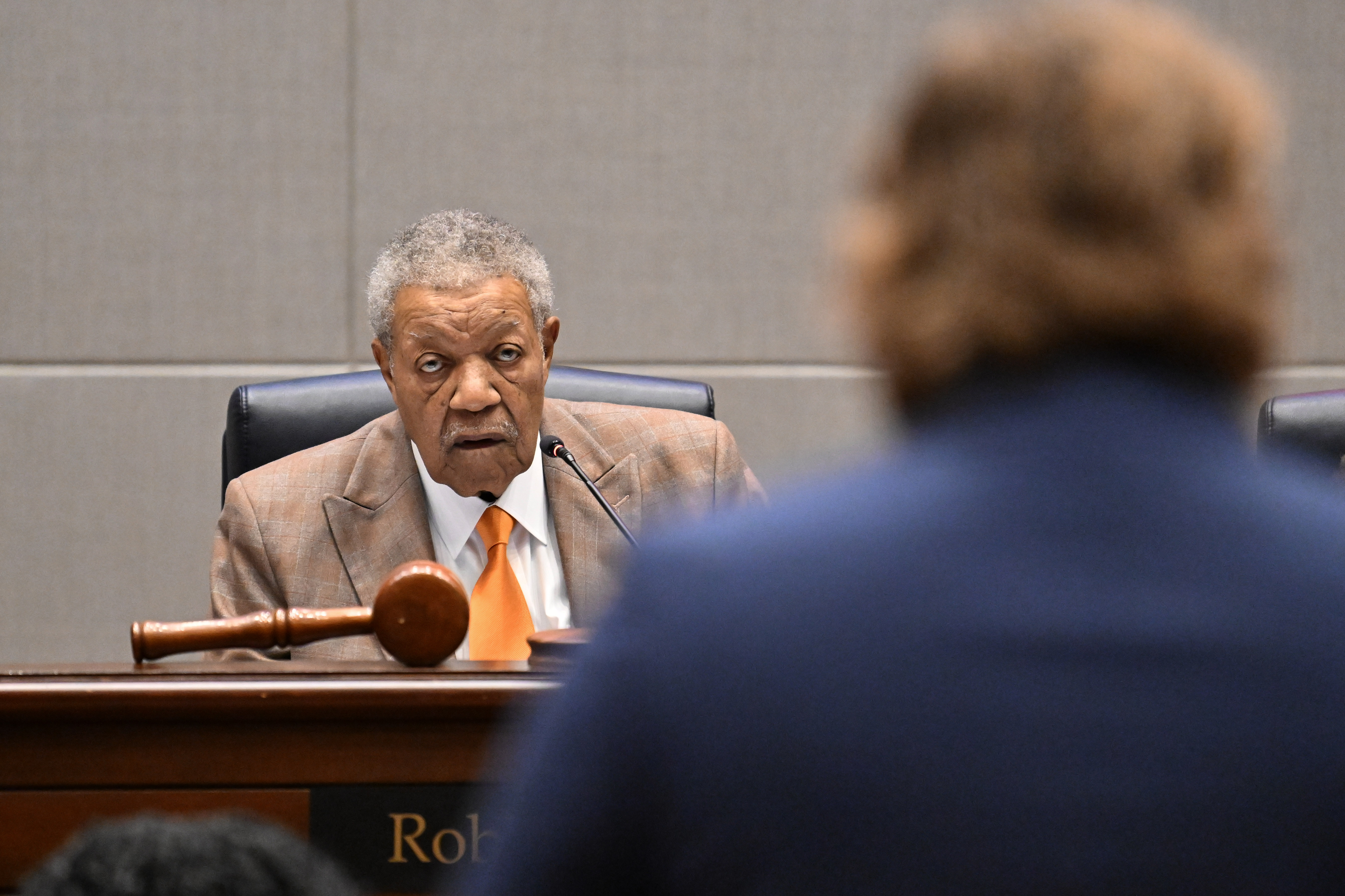 Fulton County Board of Commissioners Chairman Robb Pitts looks as Kyle Gomez (foreground), with Common Cause GA, expresses his appreciation after the Fulton County Board of Commissioners proclaiming “Fulton County Department of Registration and Elections Appreciation Day" during public comment at the Fulton County Government Center, Wednesday, Feb. 4, 2026, in Atlanta. (Hyosub Shin/AJC)
