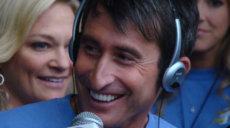 Bert Weiss (with his wife Stacey behind ) at Bert's Big Adventure send off in 2013. CREDIT: Rodney Ho/rho@ajc.com