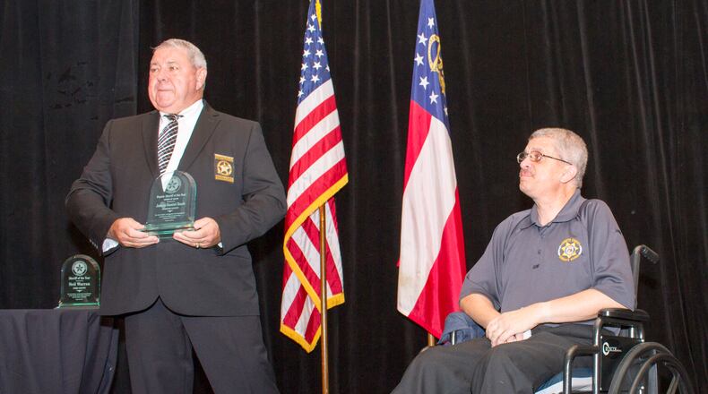 Forsyth County Deputy Daniel Rush (right) received the Deputy Sheriff of the Year Award of Valor after being wounded in an armed assault of the Forsyth courthouse in early June. FORSYTH COUNTY SHERIFF’S OFFICE