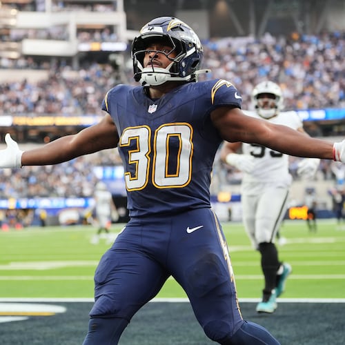Los Angeles Chargers running back Kimani Vidal (30) celebrates after scoring a touchdown during the second half of an NFL football game against the Las Vegas Raiders, Sunday, Nov. 30, 2025, in Inglewood, Calif. (AP Photo/Jae C. Hong)