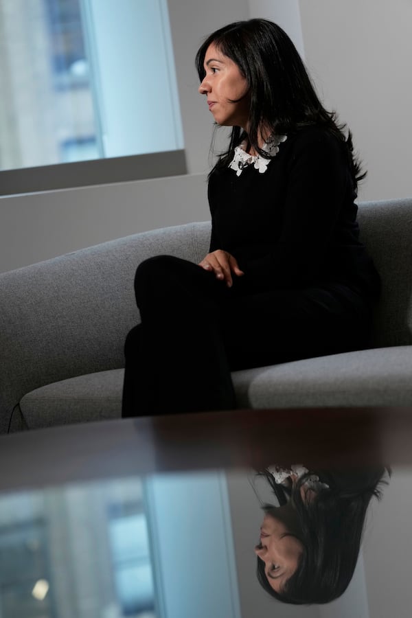 Casandra Almonte speaks to reporters in New York, Thursday, March 20, 2025. (AP Photo/Seth Wenig)