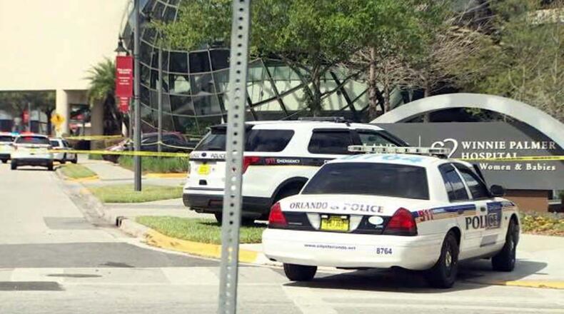 Police arrive at Winnie Palmer Hospital for Women and Babies Sunday. An 11-year-old girl was brought there after she was stabbed to death, police say, by her mother.