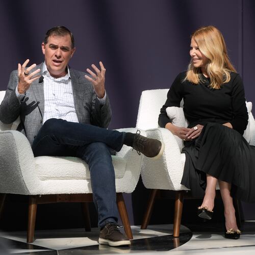 Matt Garman, CEO of AWS, left, speaks next to Denise Dresser, chief revenue officer of OpenAI, at a What's Next with AWS event Tuesday, April 28, 2026, in San Francisco. (AP Photo/Jeff Chiu)