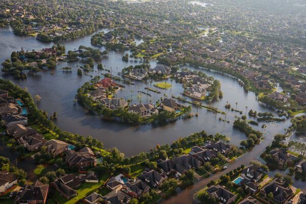 Flood water surrounds homes in a residential neighborhood in the wake of Hurricane Harvey on August 29, 2017  in Houston, Texas. (Marcus Yam / Los Angeles Times)