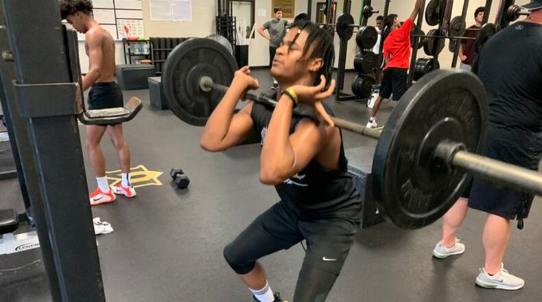 Mountain View rising freshman Justin Greene performs a squat Monday, the first day that the Georgia High School Association allowed summer conditioning for the fall sports seasons. Workout groups must be limited to 20 people at a time,meaning waves of groups throughout the day for larger sports programs. Sport had been shut down since mid-March because of the COVID-19 pandemic.