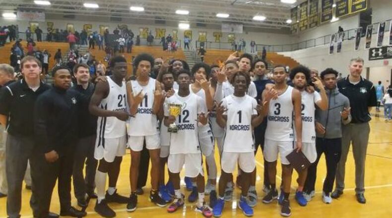 Norcross' boys basketball team won the Region 7-AAAAAAA tournament title last week on a 3-point buzzer-beater by Kyle Sturdivant (3).